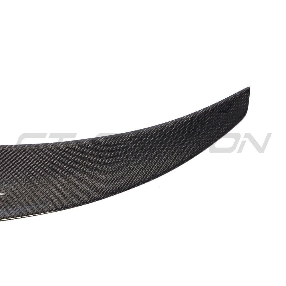 Tesla Model 3 carbon fiber V4 spoiler by CT Carbon, showing the sleek, aerodynamic rear spoiler on a 2017-2023 model.