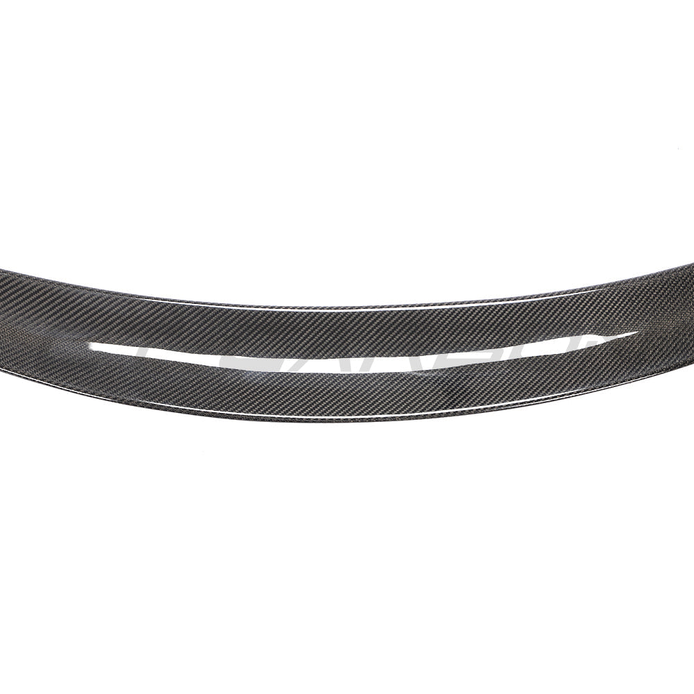 Tesla Model 3 2017-2023 carbon fibre spoiler by CT Carbon, showcasing sleek V4 aerodynamic design on the car's rear.