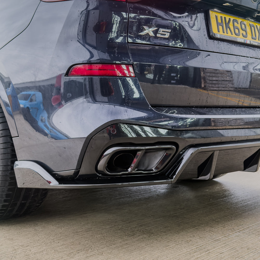 BMW X5 G05 2018+ GLOSS BLACK EXHAUST TIP ADD ON by CT Carbon, close-up of the sleek black exhaust tip accessory.