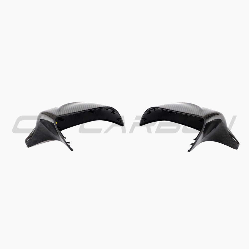 Tesla Model 3 2017+ carbon fiber mirror caps by CT Carbon, V2 accessories, showing sleek, lightweight carbon fiber finish on side mirrors.