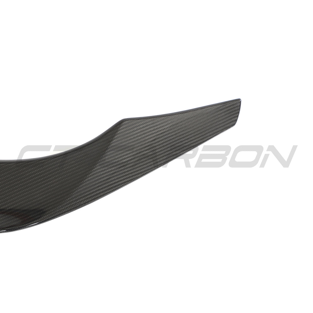 Toyota Supra 2019+ A90 CT Carbon full carbon fiber kit, showing close-up of sleek, glossy carbon fiber body parts on the car.