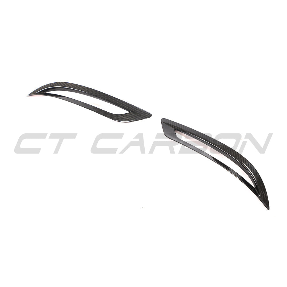 Tesla Model 3 2017-2023 carbon fiber rear reflector cover by CT Carbon, showing a sleek, lightweight automotive accessory.