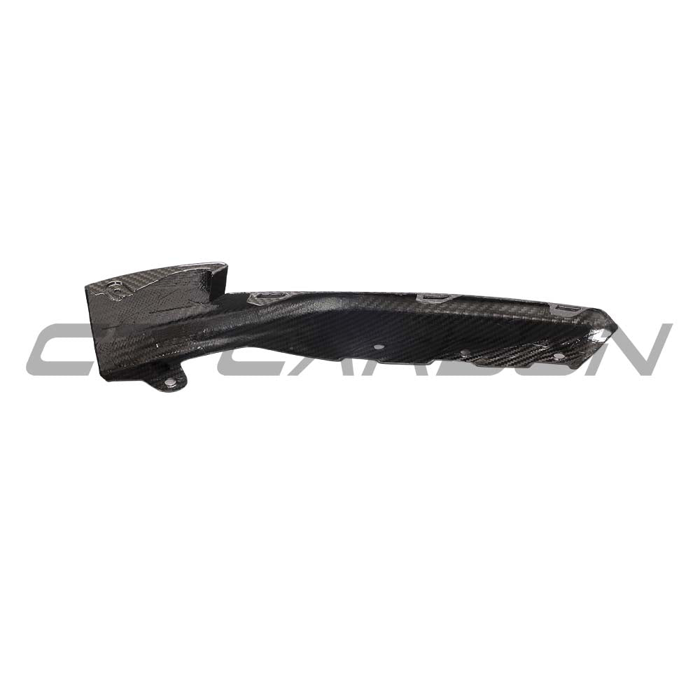 BMW M3 M4 G80 G82 carbon fiber front bumper corner replacements by CT Carbon, showcasing sleek, lightweight accessory details.