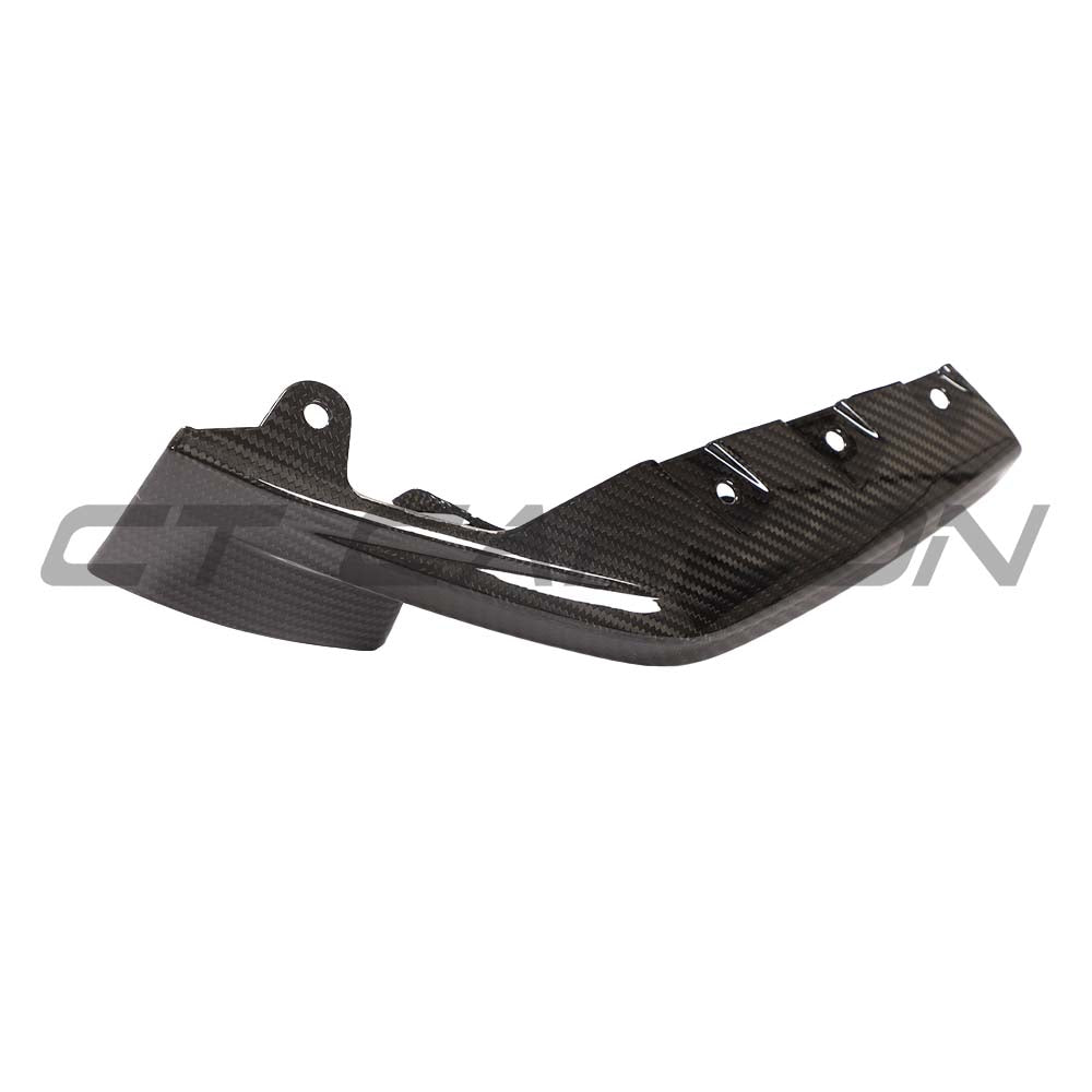 BMW M3/M4 G80/G82 carbon fiber front bumper corner replacements by CT Carbon, showing sleek, lightweight accessory parts.