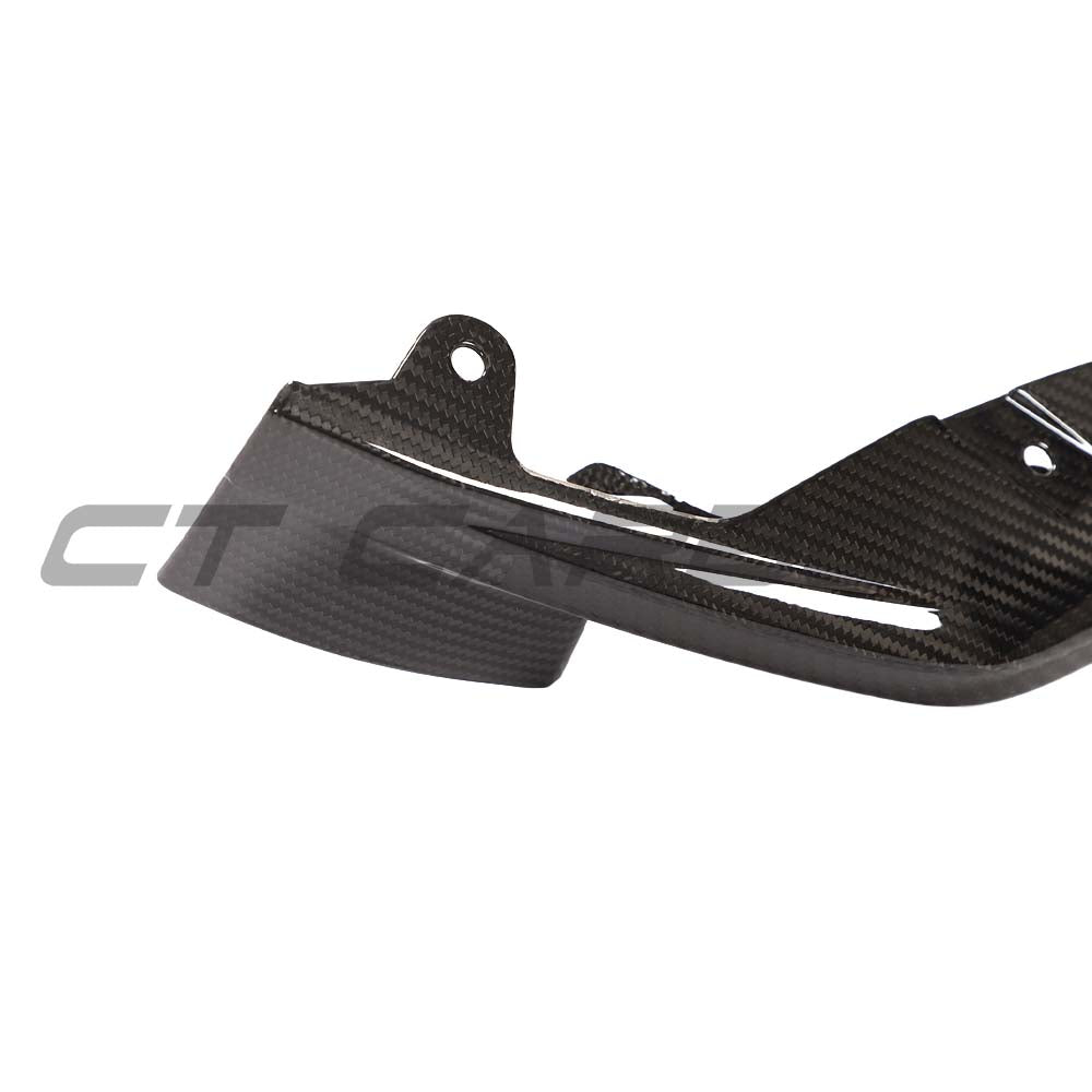 BMW M3 M4 G80 G82 G81 G83 carbon fiber front bumper corner replacements by CT Carbon, close-up of sleek, lightweight accessory.