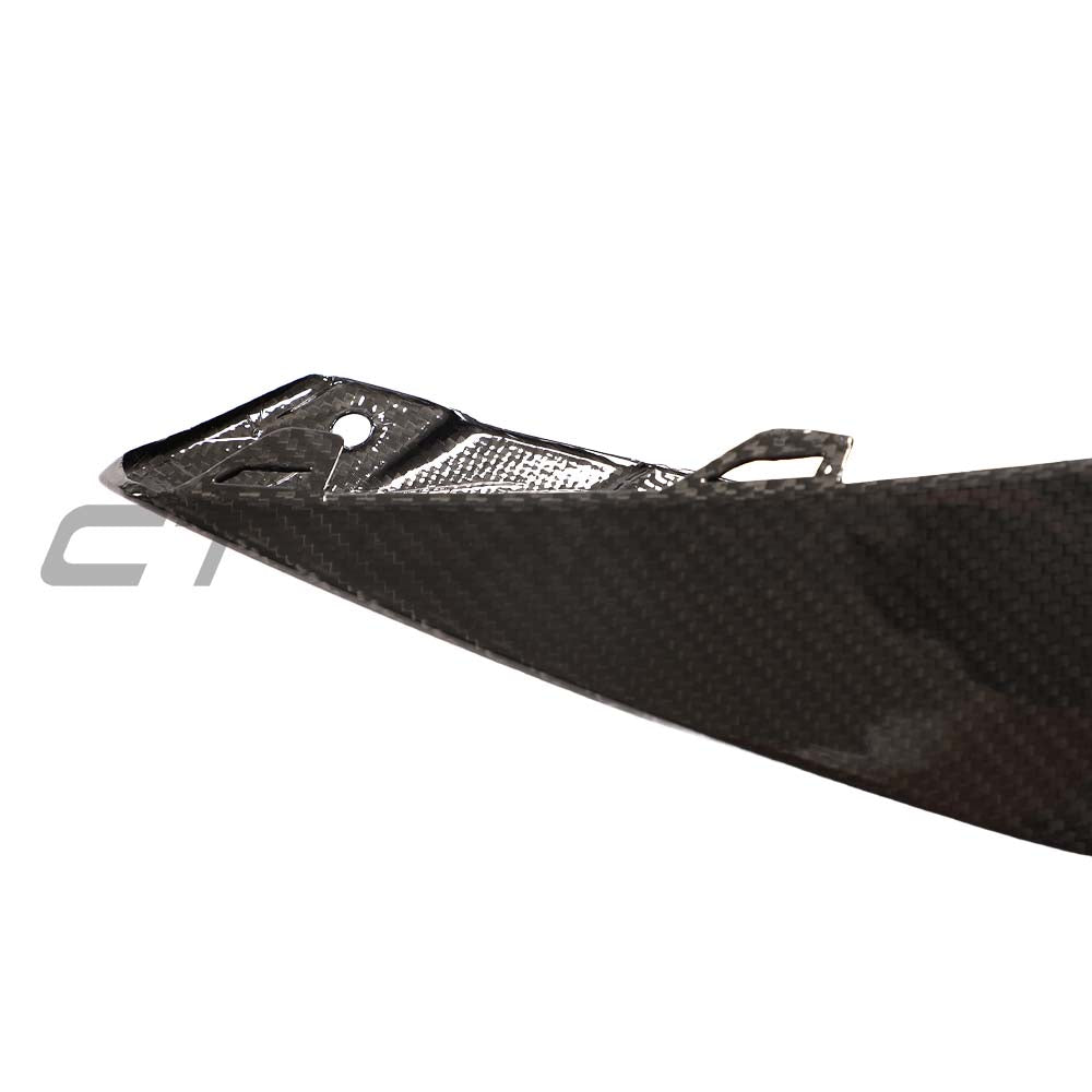 BMW M3/M4 G80 G82 carbon fiber front bumper corner replacements by CT Carbon, showing sleek, lightweight accessory parts.