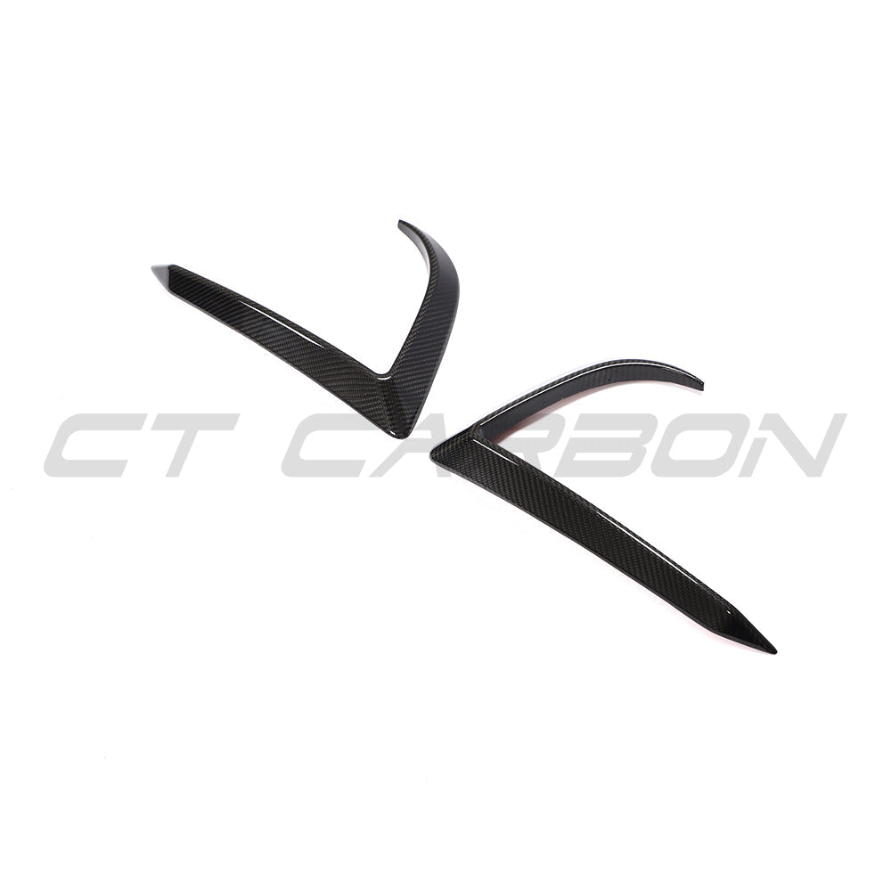 CT Carbon carbon fiber front bumper canards on a 2017-2023 Tesla Model 3, showcasing aerodynamic accessories for enhanced style.
