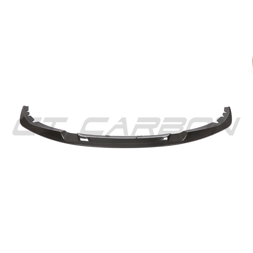 BMW 4 Series G22/G23 carbon fiber splitter V2 by CT Carbon, showing sleek, lightweight aerodynamic design on a black vehicle.