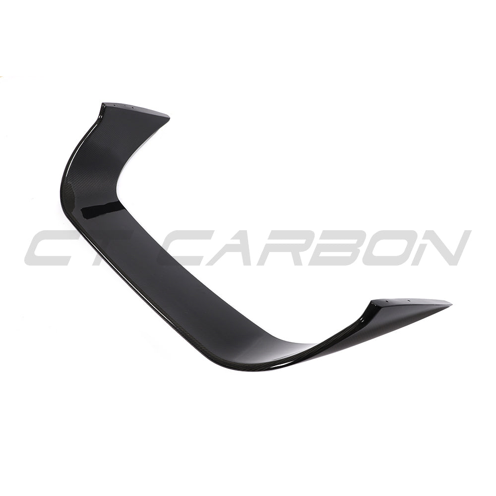 Toyota Supra 2019+ A90 carbon fiber spoiler by CT Carbon, showcasing the sleek, aerodynamic design with a textured carbon fiber finish.