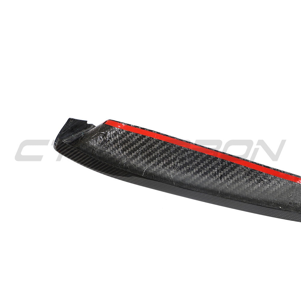 CT Carbon Porsche 992 Carrera 2018-2024 carbon fibre corner splitters installed on the front of the sports car.