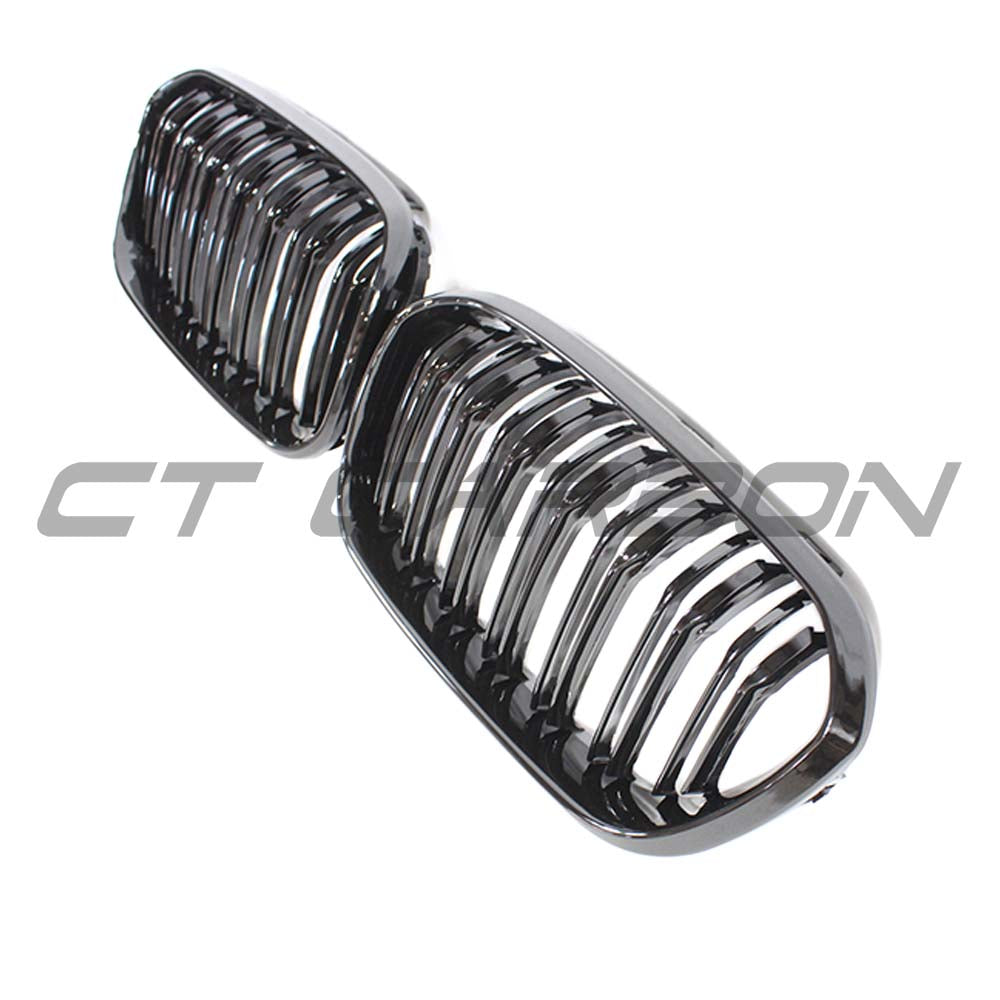 BMW F20 1 Series LCI double slat gloss black grille by CT Carbon, showing close-up of sleek, shiny black grille design.