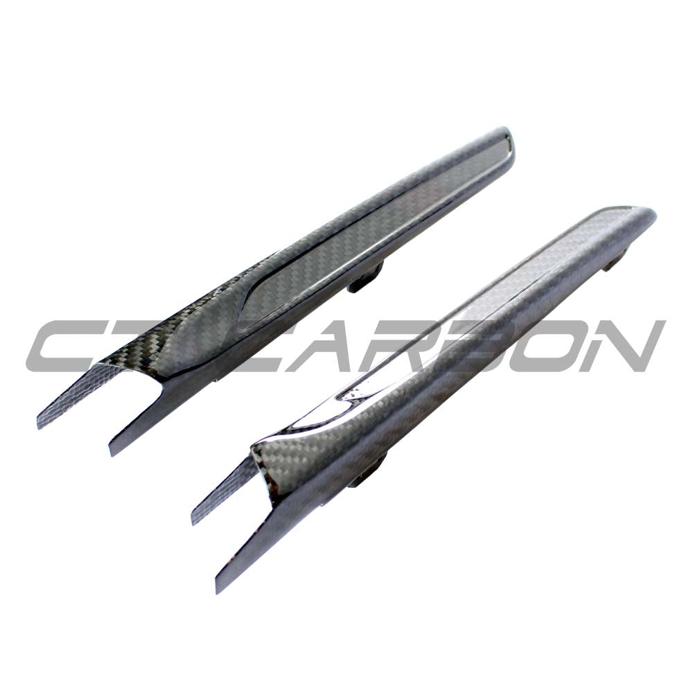 BMW M3 M4 (F80 F82 F83) Carbon Fiber Side Vents by CT Carbon, close-up of sleek, textured carbon fiber accessory on car side panel.