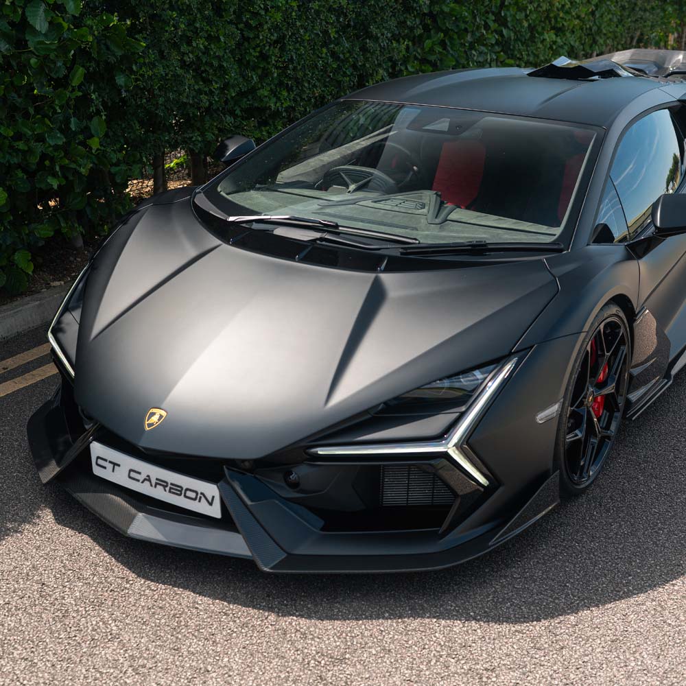Lamborghini Revueltto carbon fibre front splitter by CT Carbon, featuring sleek design and aerodynamic detailing.