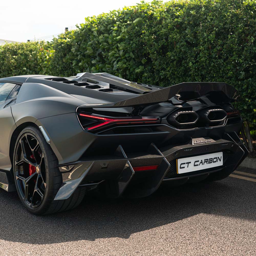 Lamborghini Revuletto carbon fibre rear diffuser by CT Carbon, showcasing sleek aerodynamic design and textured carbon fibre finish.