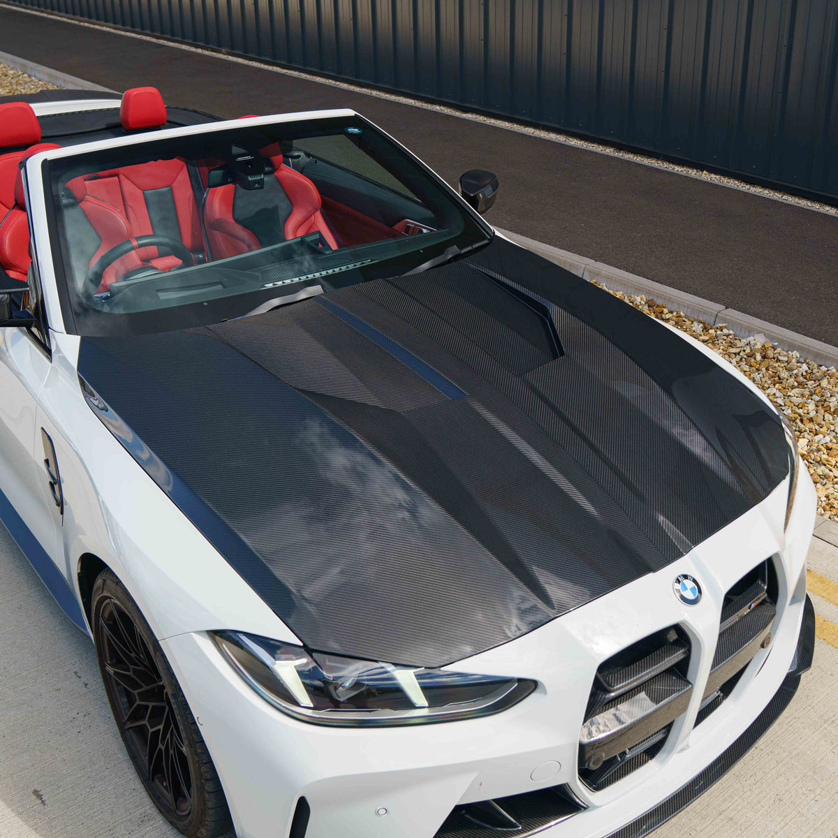 BMW G80 G82 M3 M4 2021+ dry carbon fiber bonnet by CT Carbon, showcasing lightweight, textured carbon fiber surface.