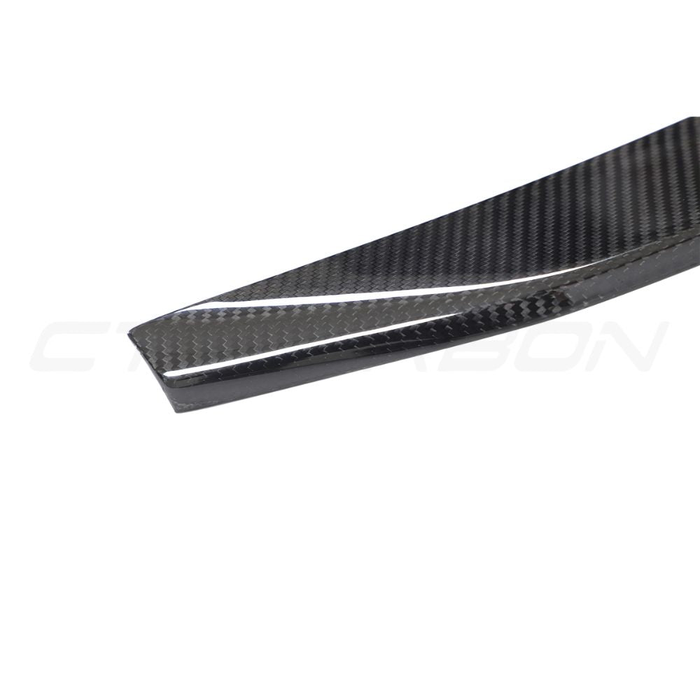 Lamborghini Urus carbon fibre boot spoiler by CT Design, showcasing sleek, aerodynamic car accessory with a glossy finish.