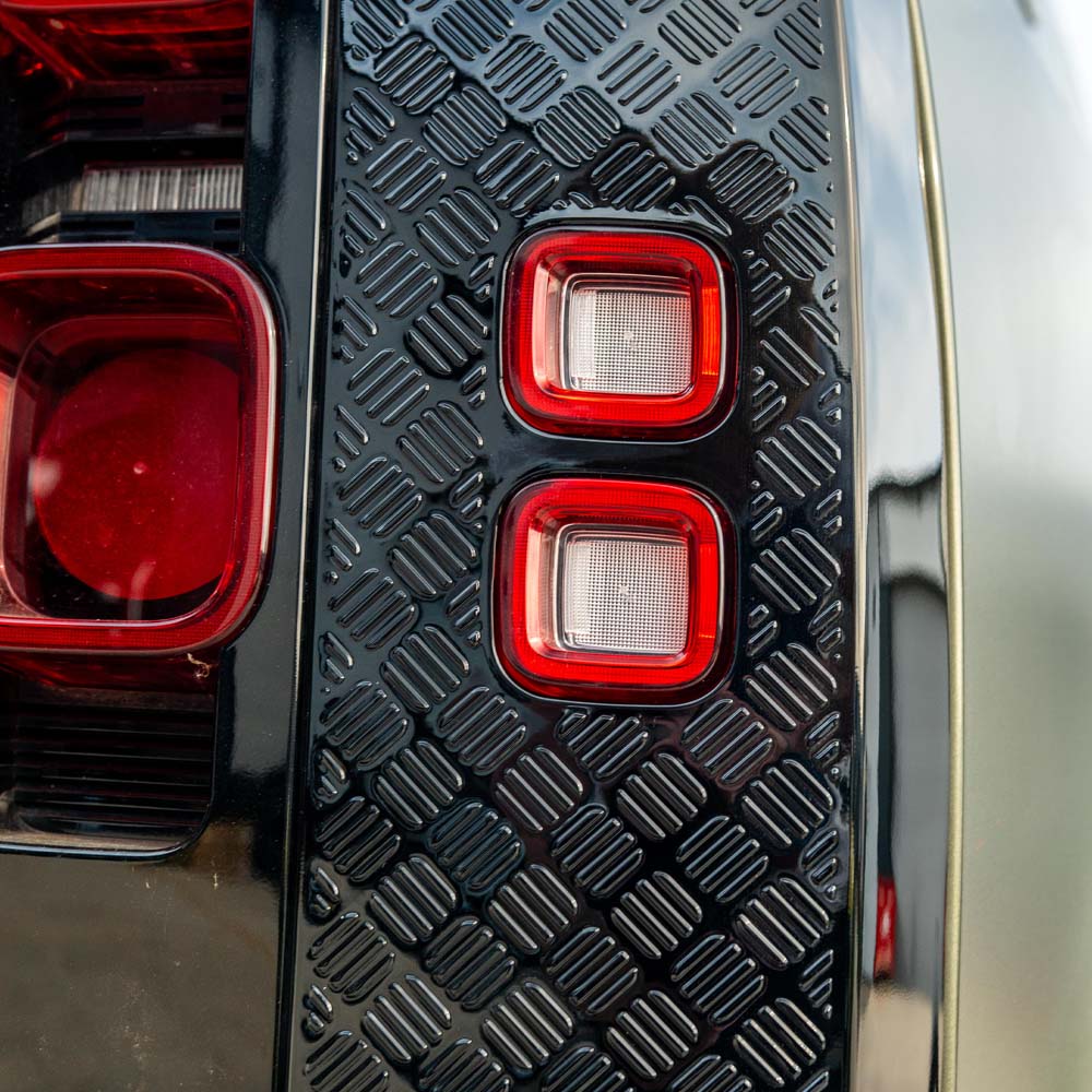 LAND ROVER Defender L663 110 gloss black anti-scratch trim set by CT Carbon, showing sleek, durable vehicle exterior trim pieces.