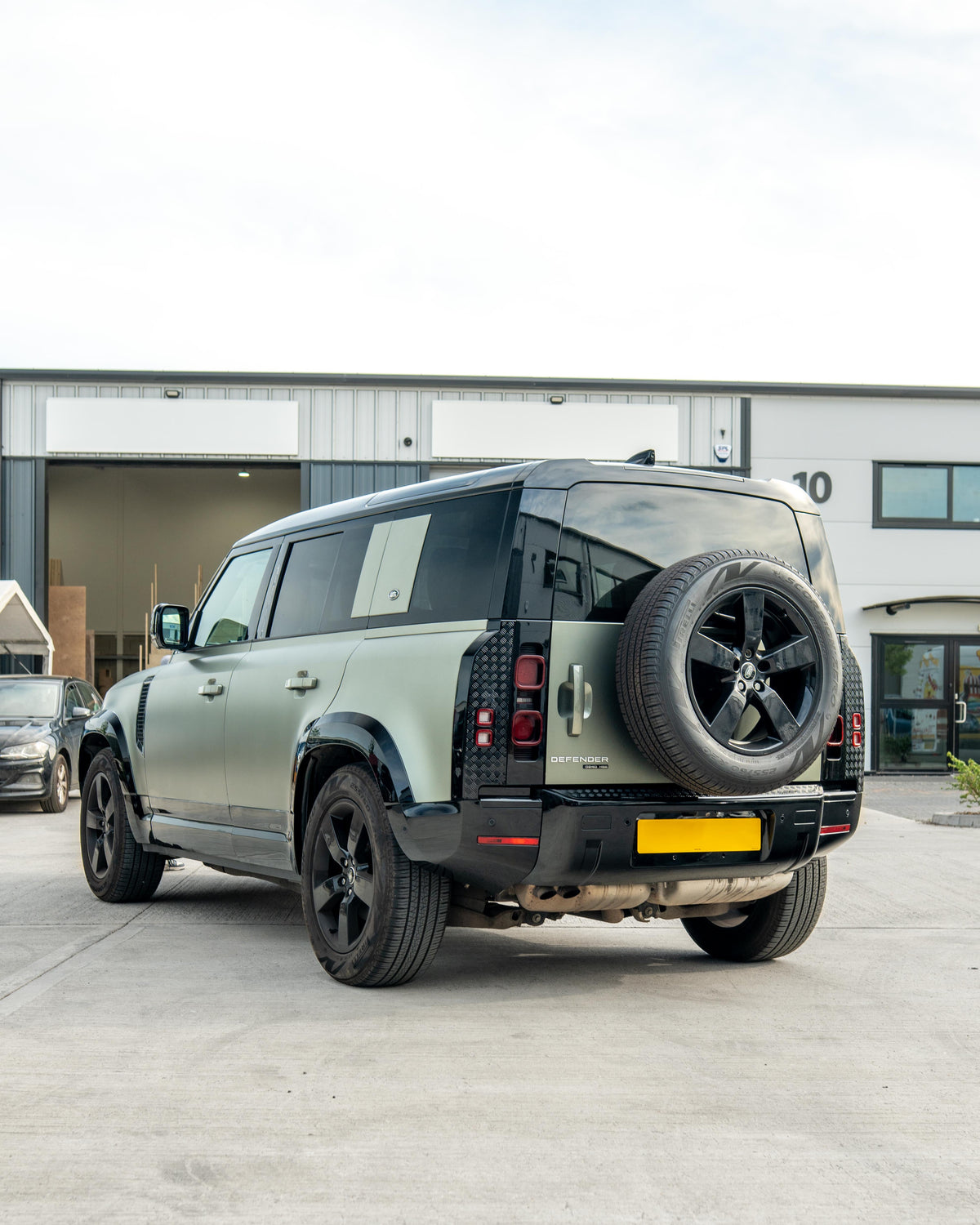 Gloss black door panels for Land Rover Defender L663 110 by CT Carbon, anti-scratch trim set for enhanced vehicle interior.