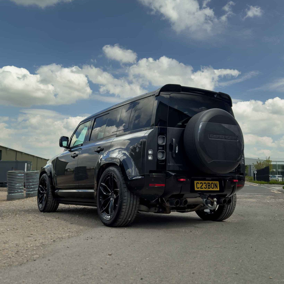 CT Carbon gloss black wide arch fenders for Land Rover Defender L663 110, durable automotive accessories with a sleek finish.