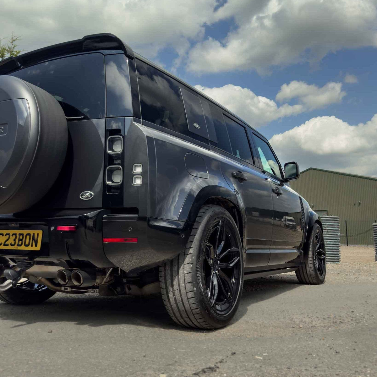 CT Carbon gloss black wide arch fenders for Land Rover Defender L663 110, durable accessories with a sleek finish.
