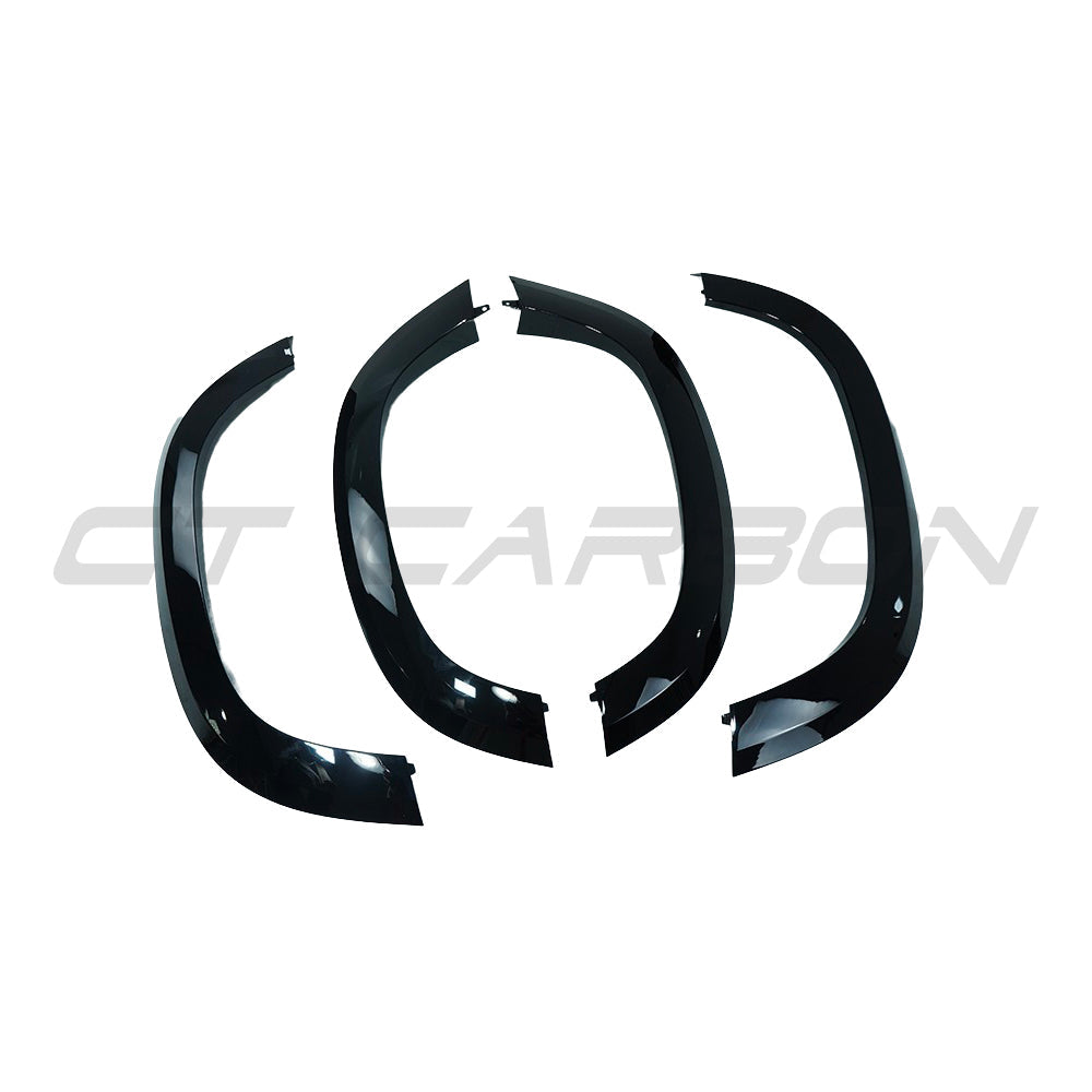 Pair of CT Carbon gloss black wide arch fenders for Land Rover Defender L663 90, enhancing sporty appearance and protection
