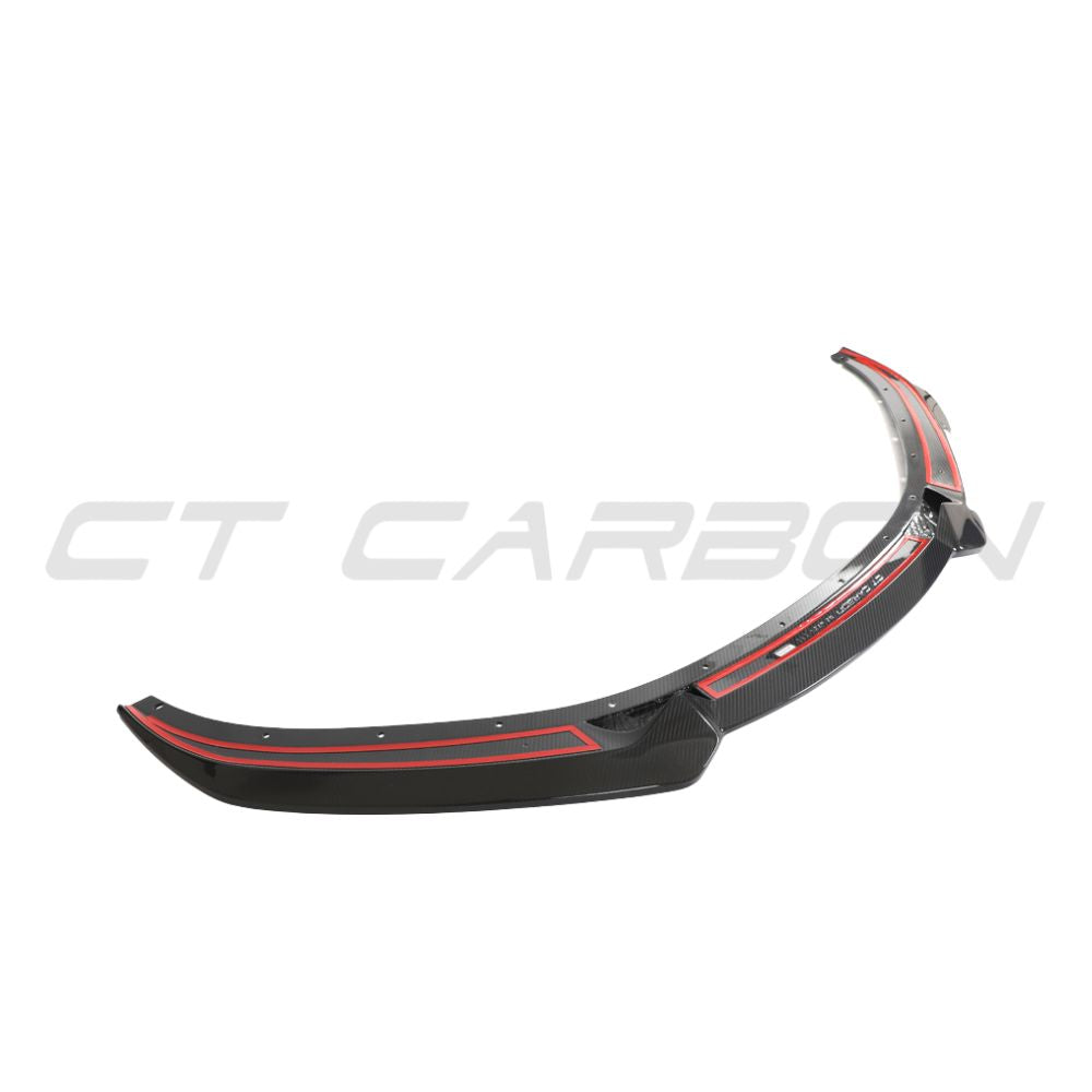 Carbon fiber front splitter for Lotus Emira by CT Design, showcasing sleek aerodynamic design and lightweight construction.