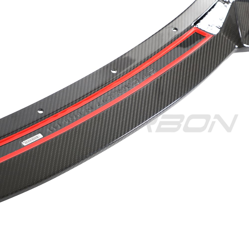Lotus Emira carbon fiber front splitter by CT Design, showcasing sleek, lightweight automotive aerodynamic accessory.