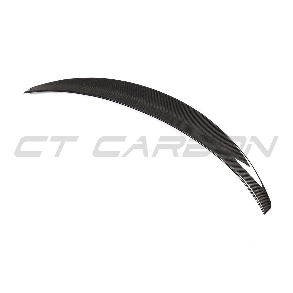 CT Carbon Tesla Model 3 2017-2023 V4 carbon fibre spoiler mounted on the car's rear, showcasing sleek aerodynamic design.