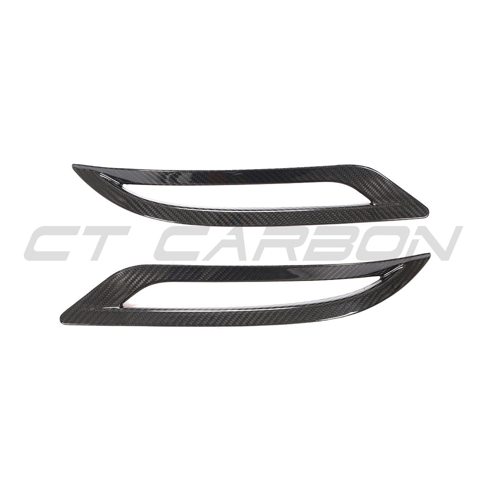 Carbon fiber rear reflector cover for Tesla Model 3 (2017-2023) by CT Carbon, shown on the back of the vehicle.