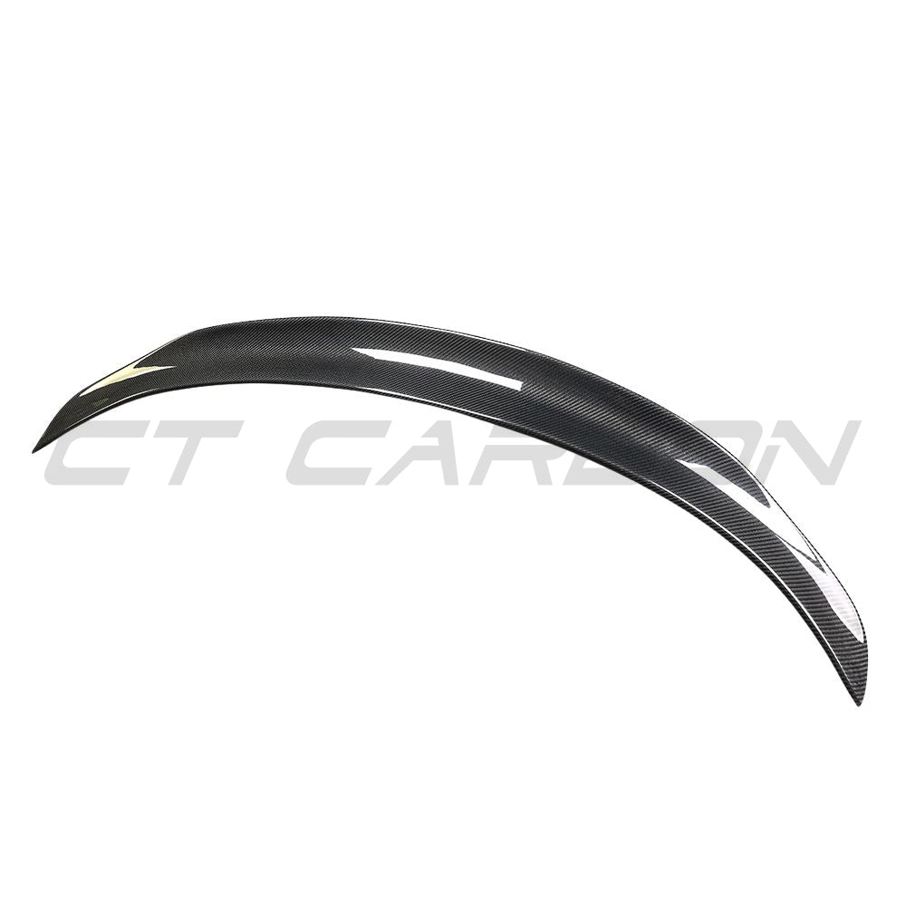 Carbon fiber spoiler for Tesla Model 3 2017-2023 by CT Carbon, showing its sleek, aerodynamic design on the vehicle.
