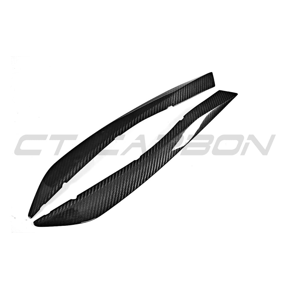 Carbon fiber headlight eyebrows accessory for Audi A5, S5, RS5 B9 coupe 2016-2019 by CT Carbon, shown on vehicle.
