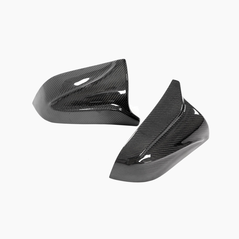 Tesla Model 3 2017+ carbon fiber mirror covers by CT Carbon, V2 accessories, showing sleek, textured carbon fiber finish on side mirrors.