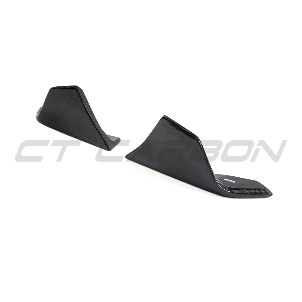 CT Carbon front bumper corner accessories for Toyota Supra 2019+ A90, featuring carbon fibre finish on a sleek sports car.