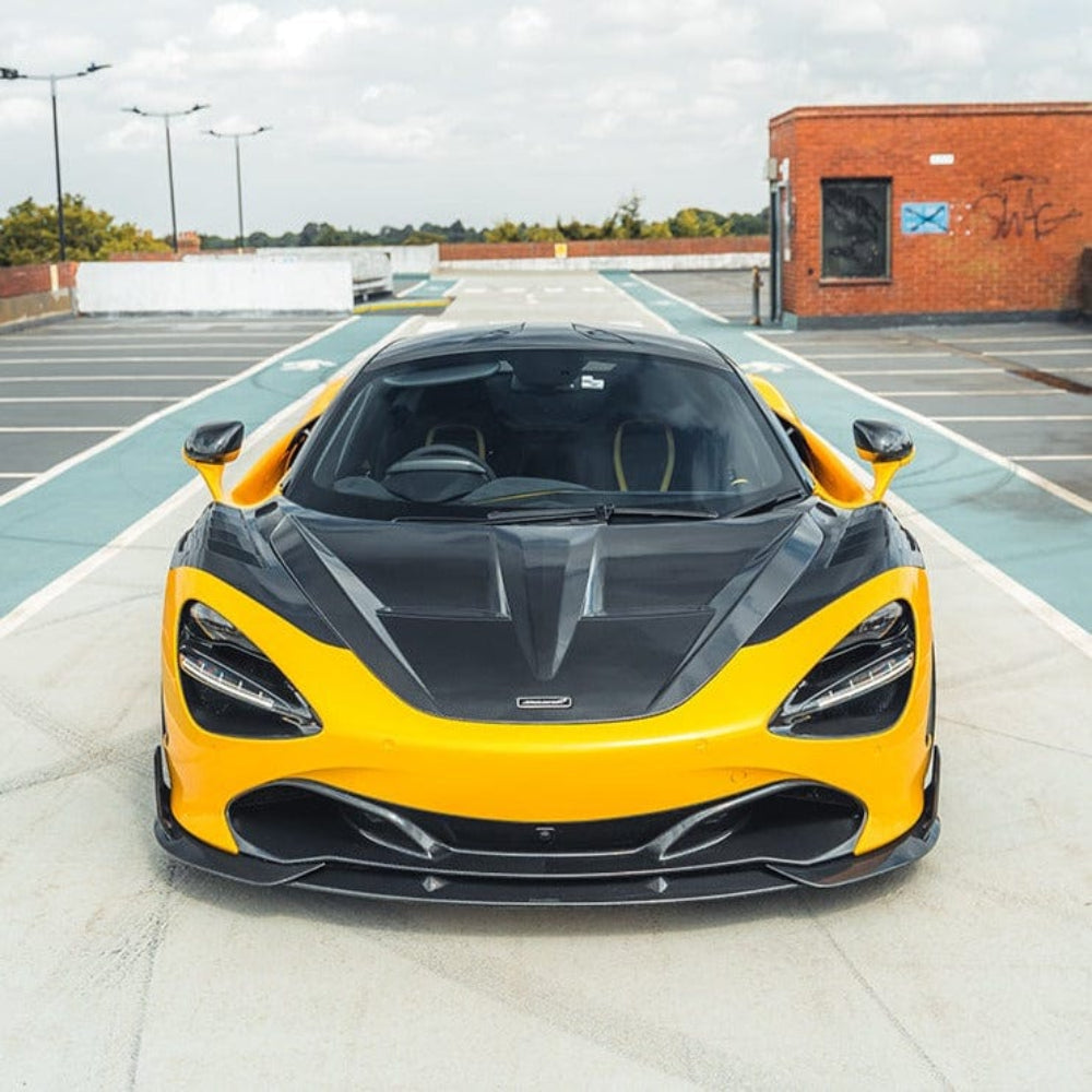 Carbon fiber splitter for McLaren 720S by CT Design, shown installed on the front of the sports car with detailed weave pattern.