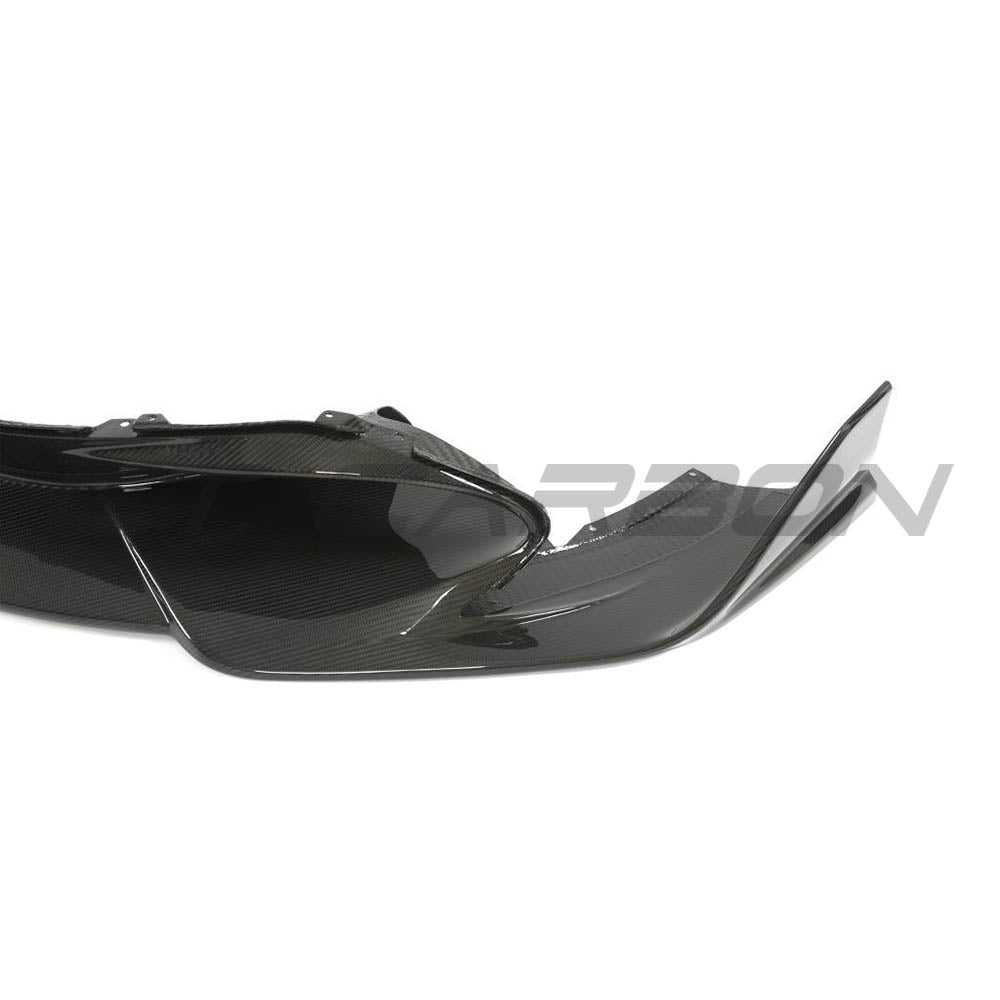 Carbon fiber splitter for McLaren 720S by CT Design V2, showcasing sleek aerodynamic design and textured carbon fiber surface.