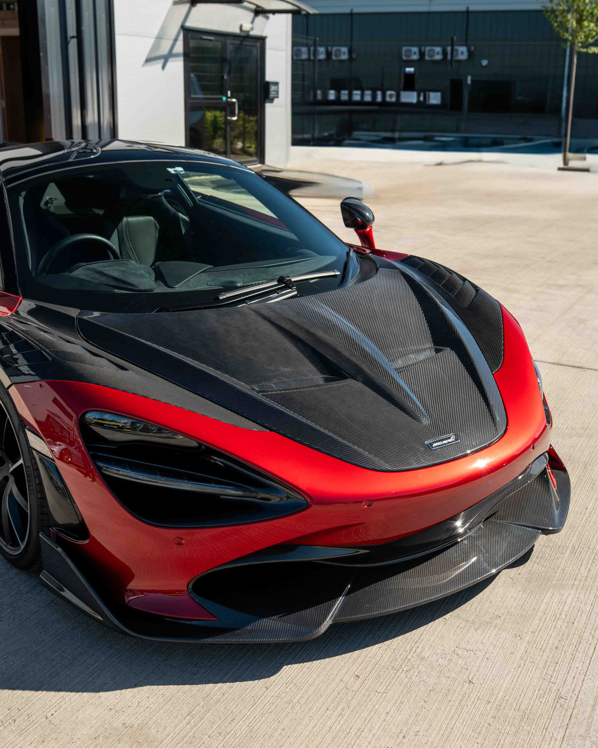 Carbon fiber splitter for McLaren 720S by CT Design V2, showcasing sleek aerodynamic design and high-quality craftsmanship.