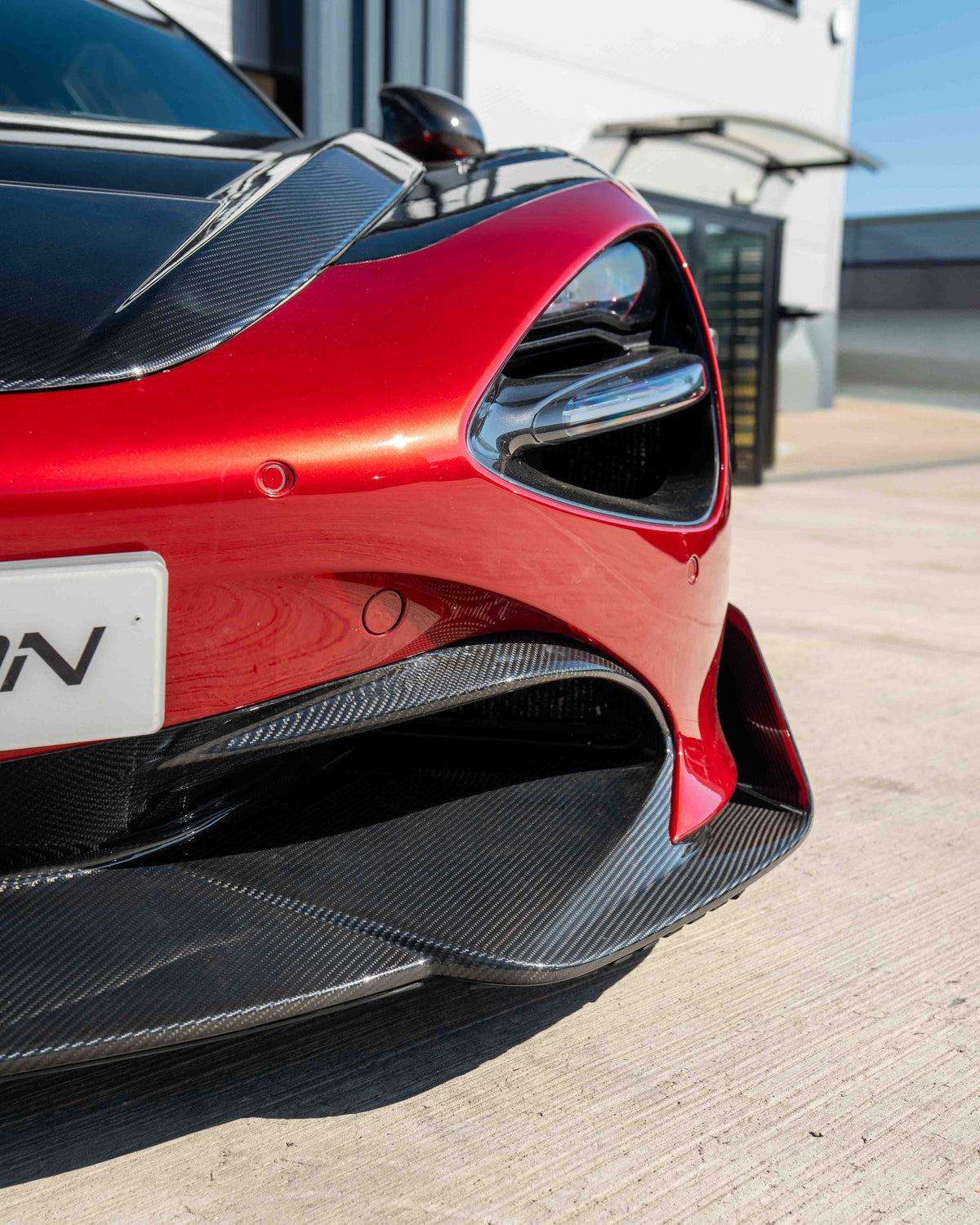 MCLAREN 720S carbon fibre splitter by CT Design V2, showcasing sleek, lightweight aerodynamic component with detailed carbon fiber texture.