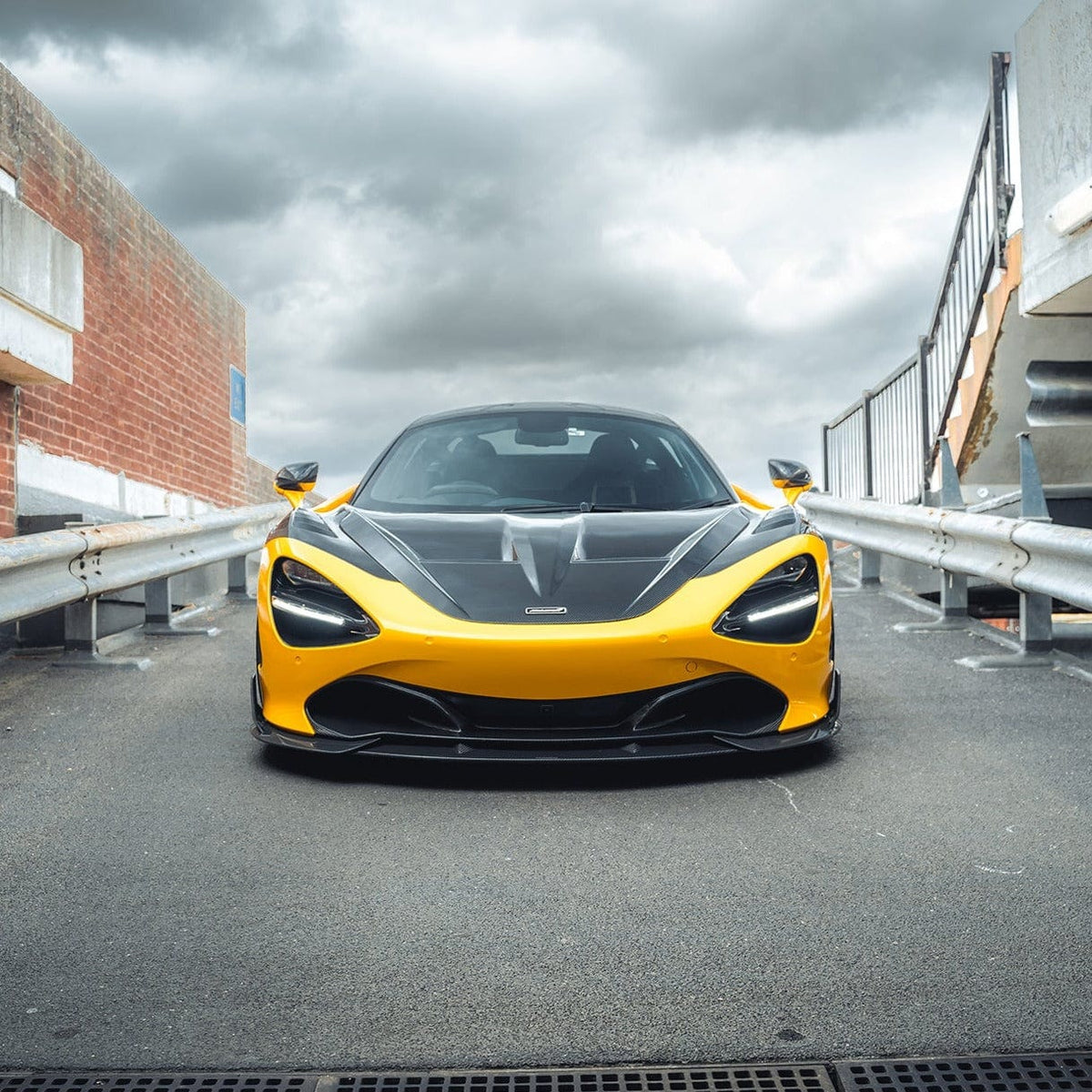 Full view of a McLaren 720S with CT Carbon's V2 full carbon fiber kit, showcasing sleek, high-performance car enhancements.