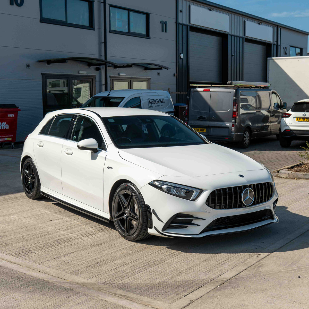 Mercedes V177 W177 A-Class grille by CT Carbon in gloss black, featuring Panamerica design with splitter and canards.