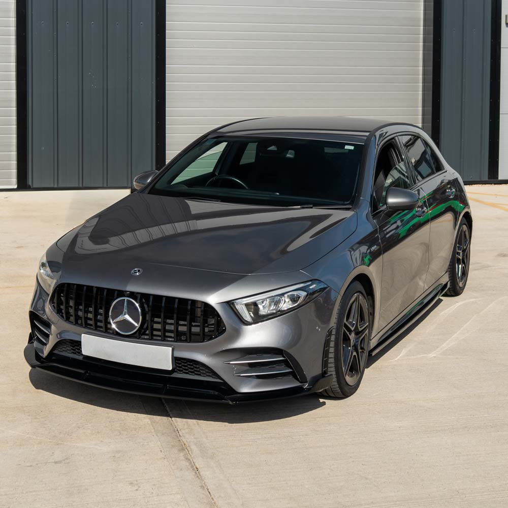 Mercedes A-Class W177 2018-2022 CT Carbon gloss black front bumper vents accessory, showing the sleek, aerodynamic design.