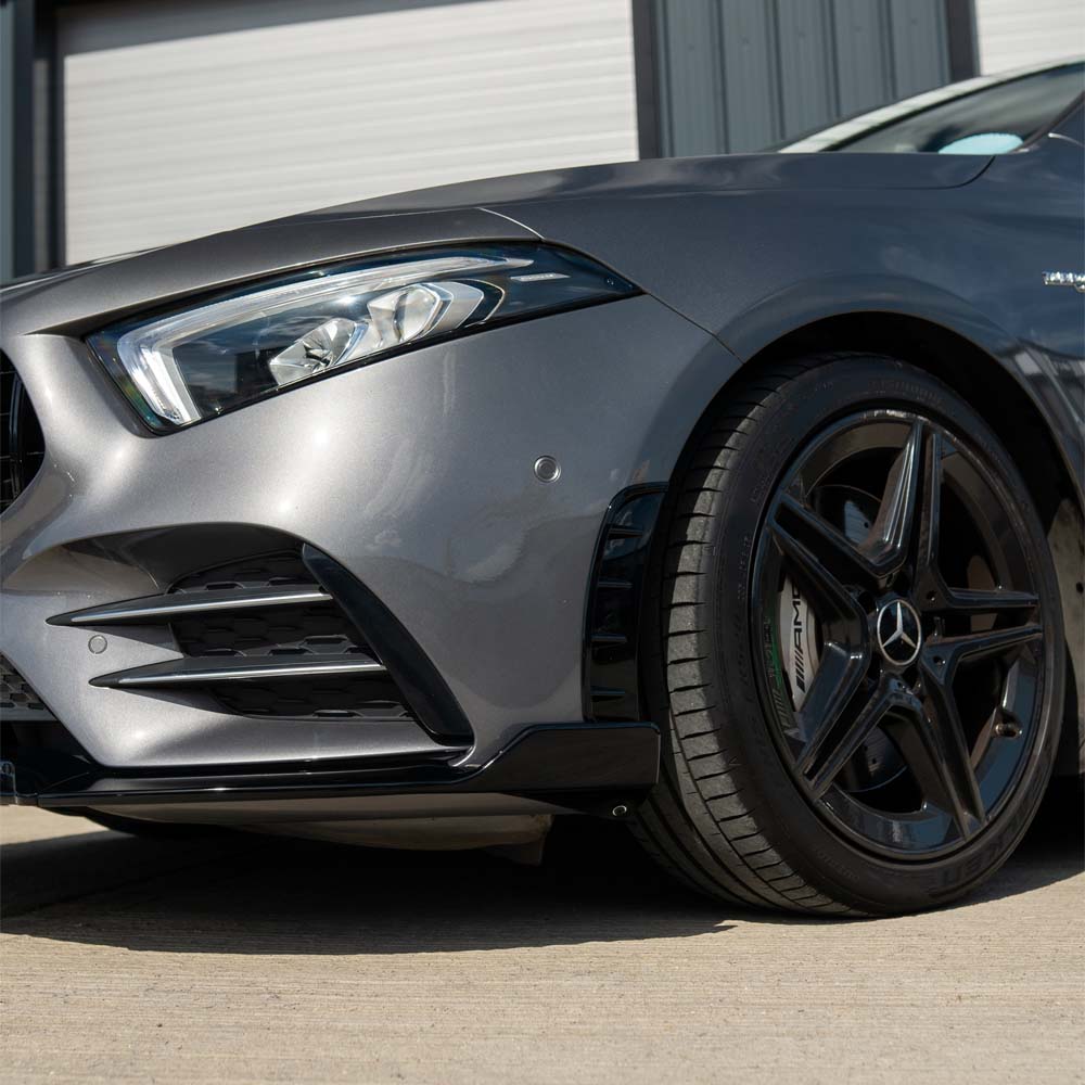 Mercedes A-Class W177 2018-2022 CT Carbon gloss black front bumper vents for enhanced sporty look.