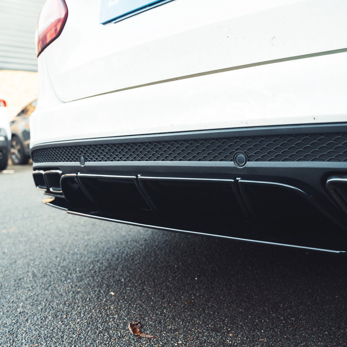 Mercedes C-Class W205 saloon estate CT Carbon gloss black diffuser with black tips, showcasing sleek rear styling and aerodynamic design.