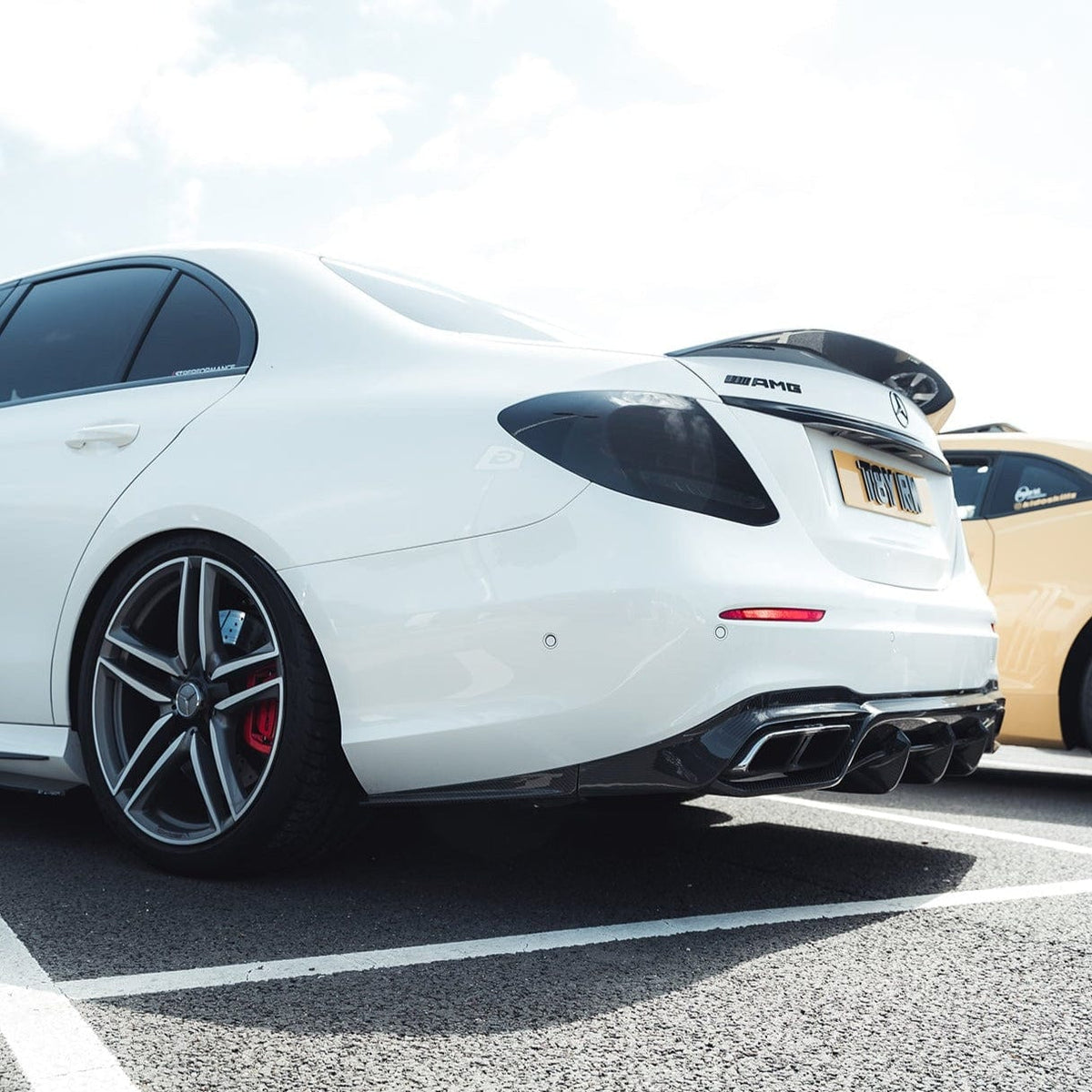 Mercedes E63 W213 2018-2020 CT Carbon full car carbon fiber kit installed on the vehicle, showcasing sleek, lightweight carbon fiber parts.