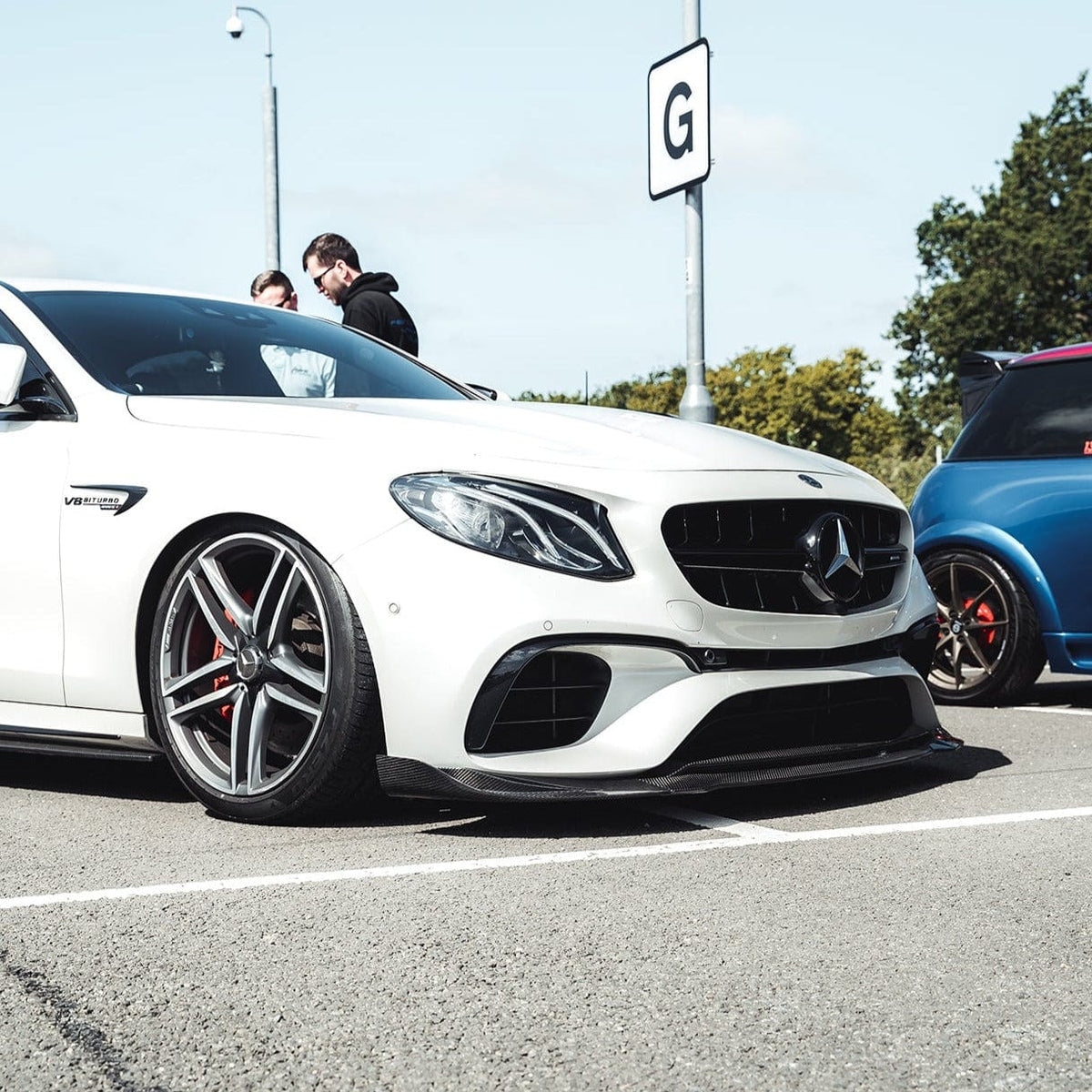 Mercedes E63 W213 2018-2020 CT Carbon full carbon fiber kit installed on the car, showcasing the sleek, lightweight carbon fiber components.