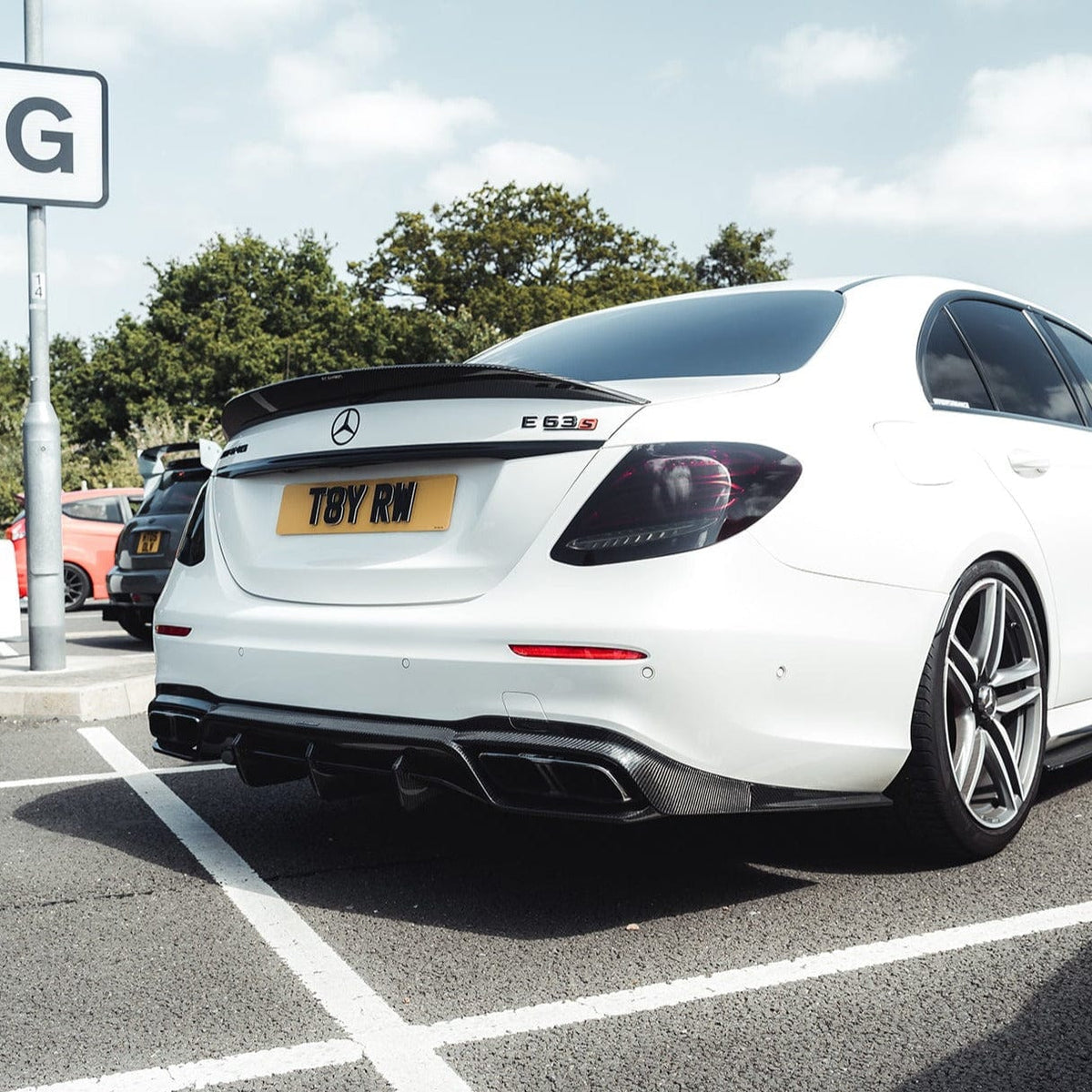 Mercedes E63 W213 2018-2020 pre-facelift full carbon fibre kit by CT Carbon, showing detailed carbon fiber parts on the car.