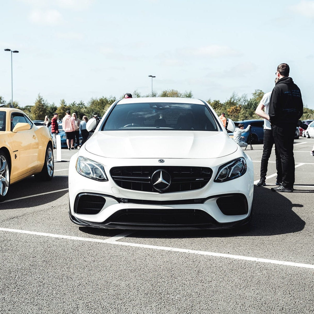 Mercedes E63 W213 2018-2020 CT Carbon full car carbon fiber kit installed on vehicle, showcasing sleek, lightweight carbon fiber parts.
