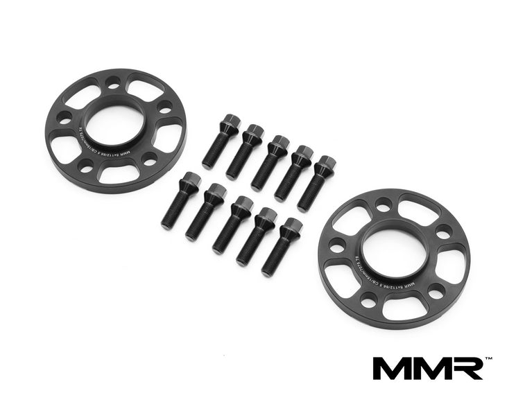 MMX Performance 12mm wheel spacers for BMW G-Series, showing metallic spacers with bolt holes and mounting surface.
