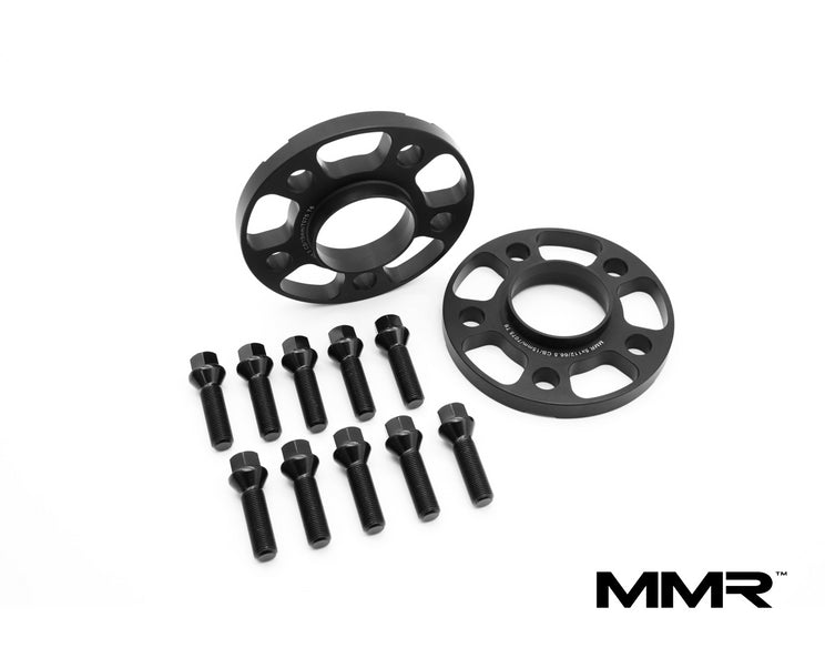 MMX Performance 12mm wheel spacers for BMW G-Series, showing the black metal spacers with bolt holes for wheel installation.