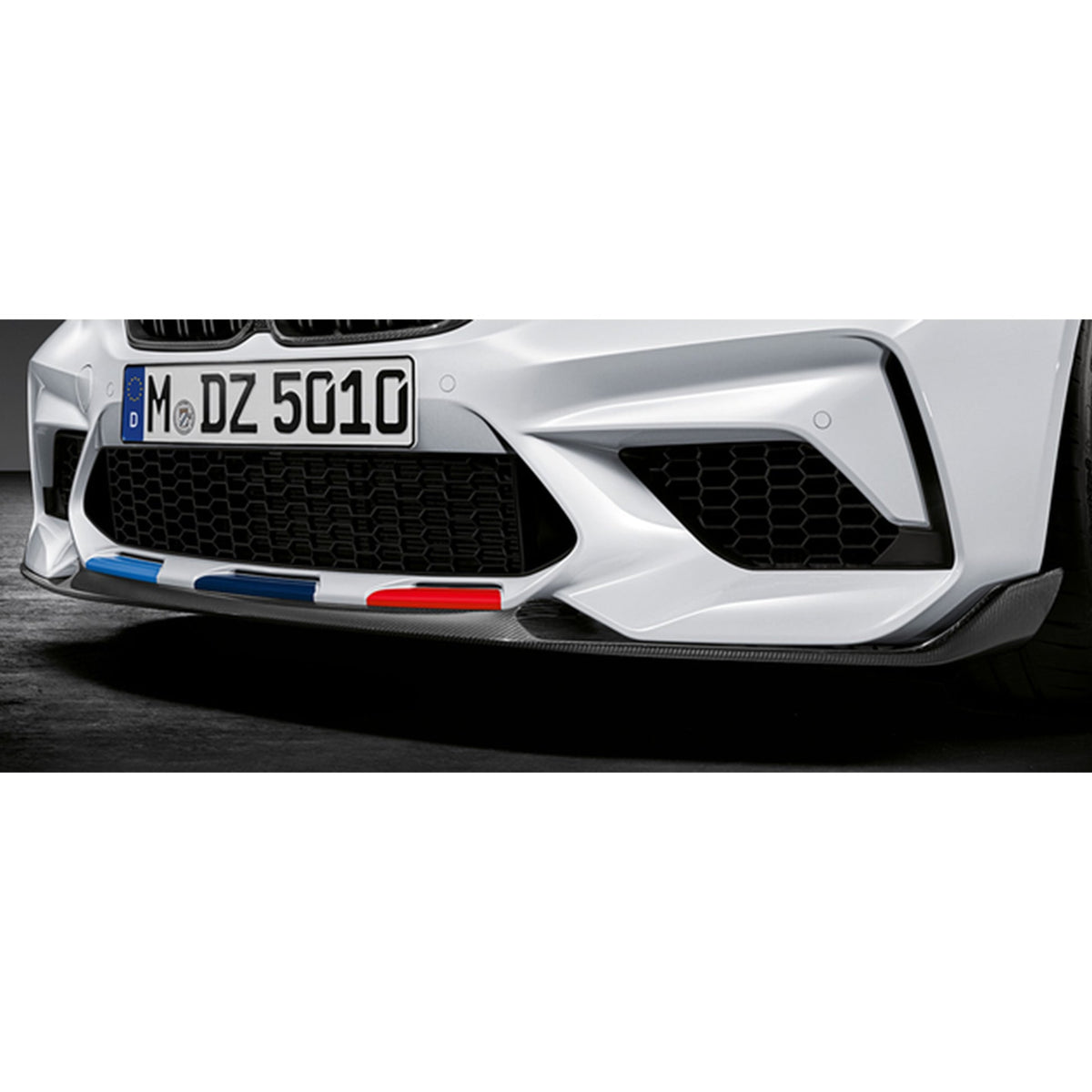 Genuine BMW M Performance F87 M2 Competition front splitter in carbon fiber, enhancing aerodynamics and sporty appearance.