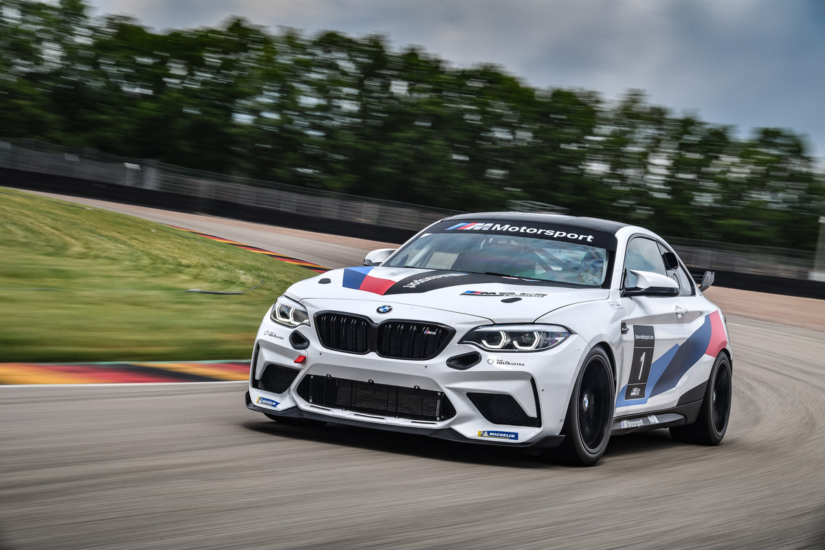 Genuine BMW Motorsport M2 CS Racing front grill kit with sporty design, featuring the iconic BMW logo on a high-performance grille.